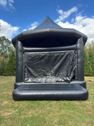 WhatsApp20Image202026 03 2520at202.59.5520PM201 177447294 1 Black Tux Bounce House - 1hp